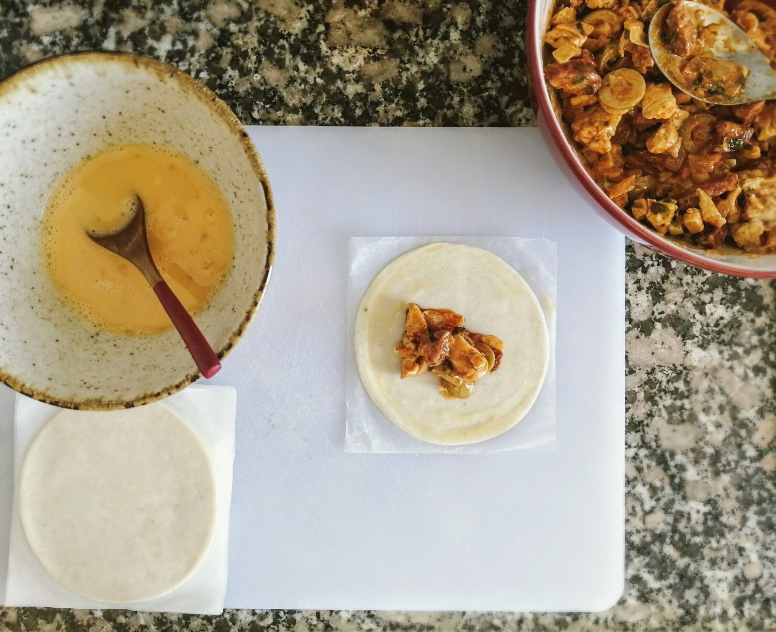 a kitchen process shot of making chicken with cider infused chorizo empanadas