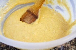 A bizcocho cake mix is made in a large bowl