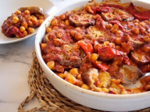 A large Mediterranean eggplant casserole is served into a white bowl