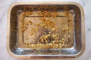 Crushed walnuts in an oven tray