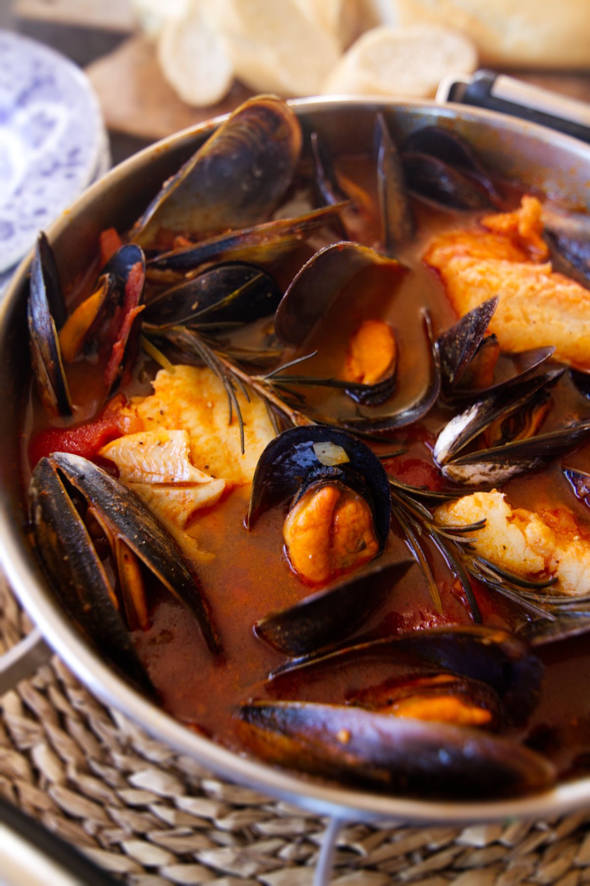 A large pot of Mediterranean Fish stew waits to be served