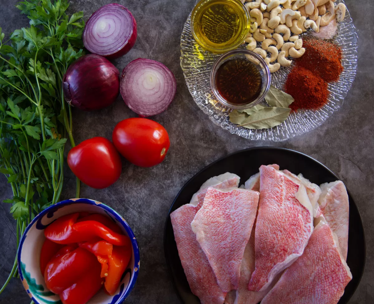 Ingredients used to make romesco de peix are laid on a counter top. 