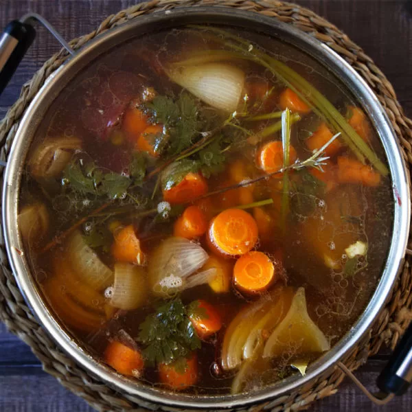 A large pot of homemade chicken stock