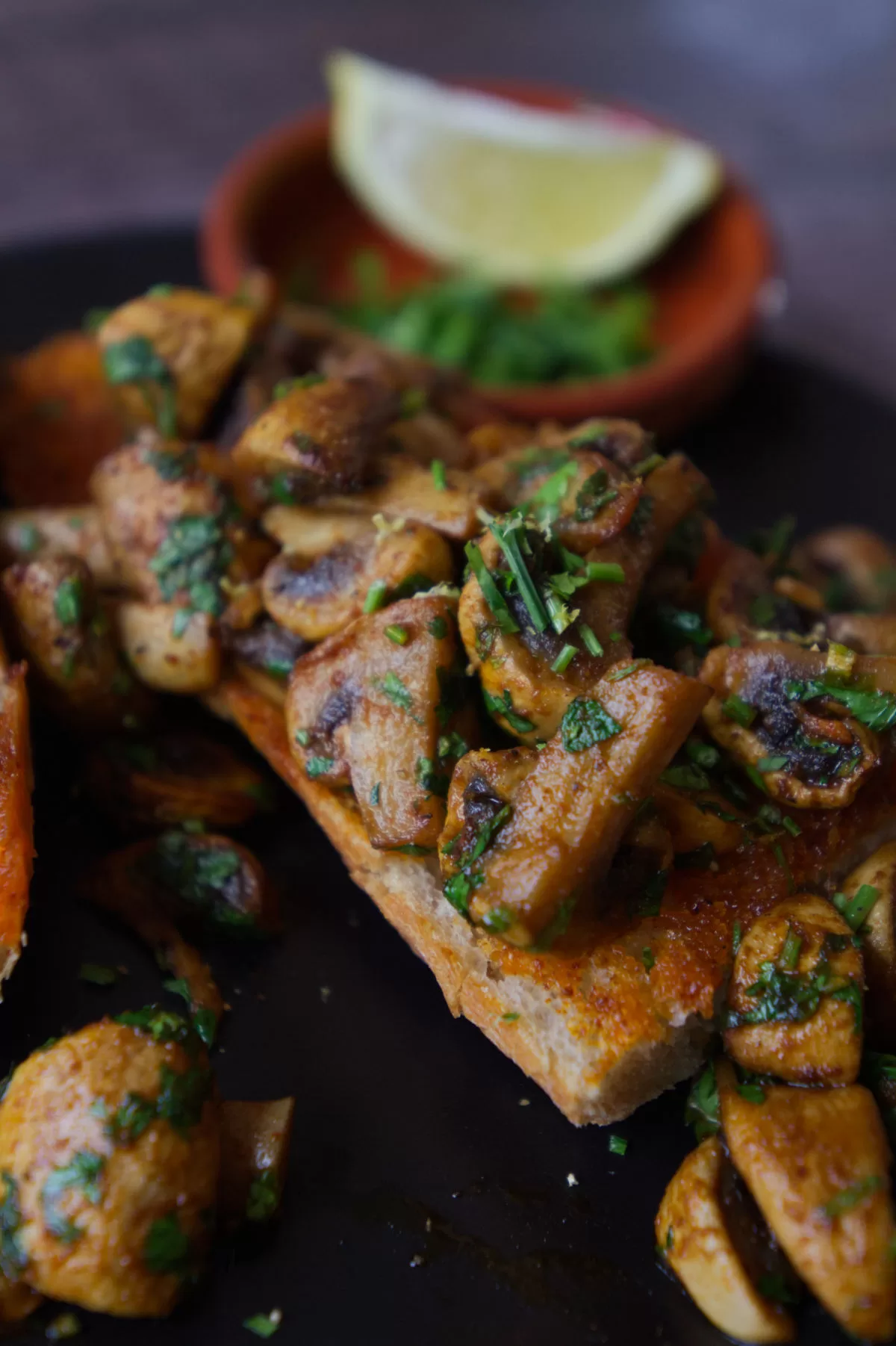 Spanish garlic mushrooms sit on a plate