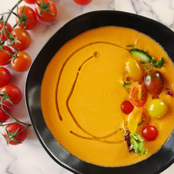 A bowl of gazpacho with garnishing