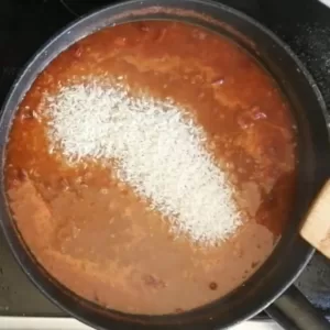 rice is added to pan of sauce