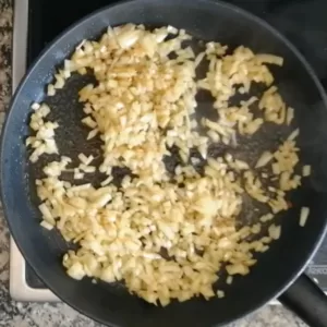 sauteed onions in a pan.