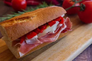 a Spanish bocadillo sits on a chopping board