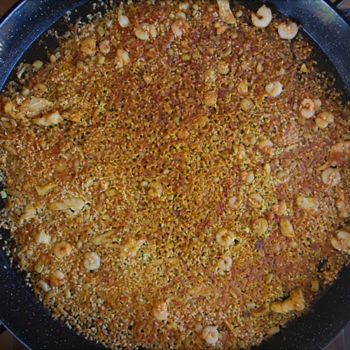 a large paella pan full of Arroz a banda.