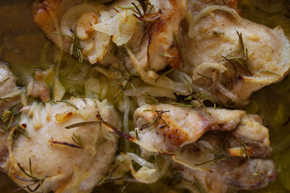 A pan of Mediterranean garlic rosemary chicken thighs.