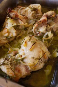 A pan of Mediterranean garlic rosemary chicken thighs.