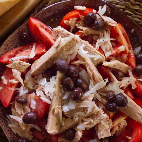 A plate of Spanish-style tuna tomato salad.