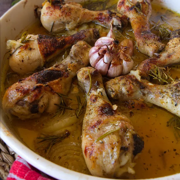 A pan of Spanish garlic chicken cooked with fresh rosemary and sherry.