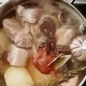 Spices and herbs are added to the stew.