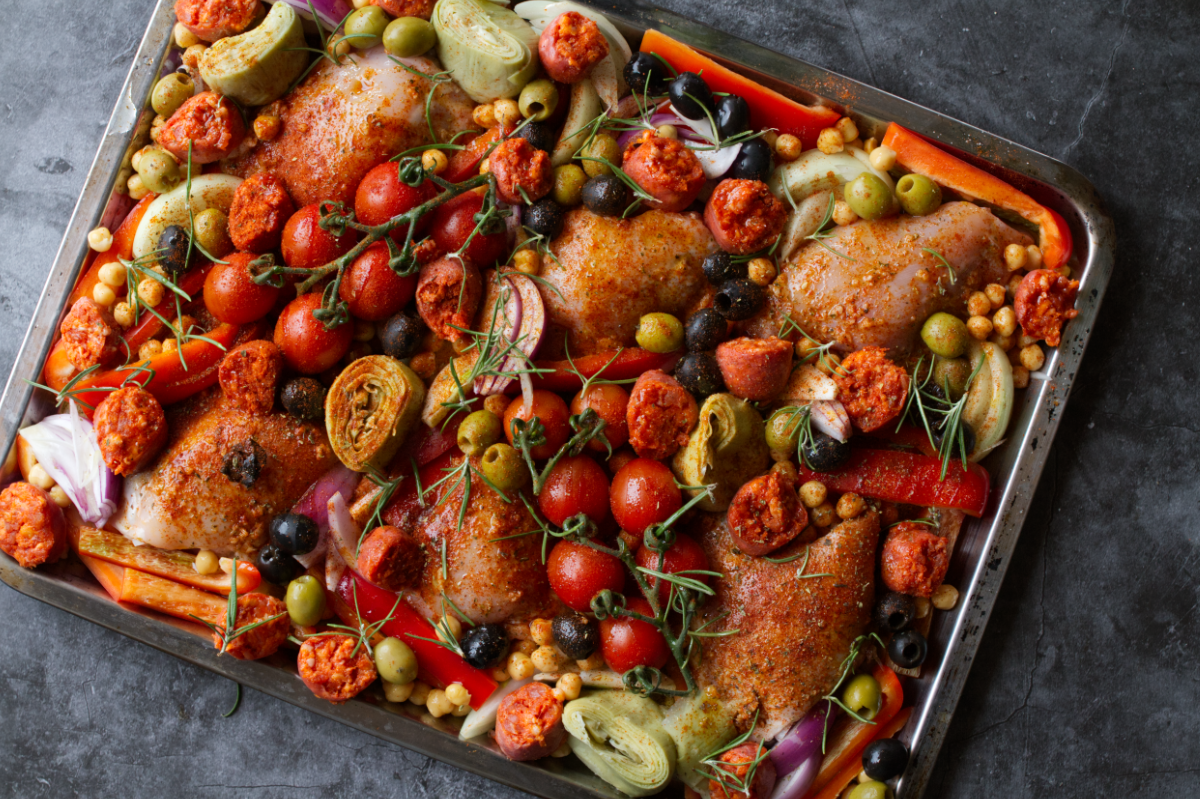 A sheet pan of chicken thighs with chorizo and roasted veg.