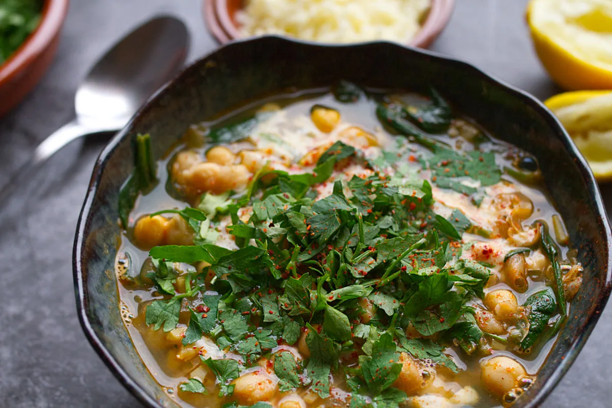 A bowl of spinach and chickpea soup.