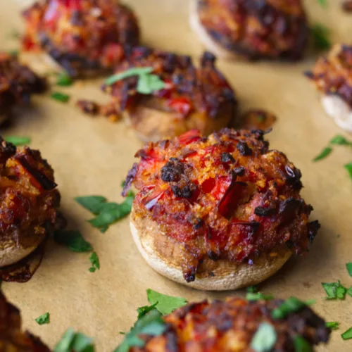 Button mushrooms stuffed with chorizo and garlic.