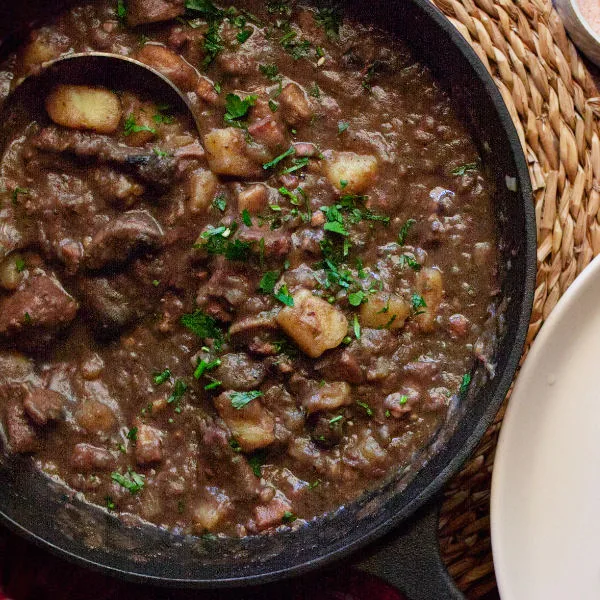 A large pot of Catalan style beef stew.