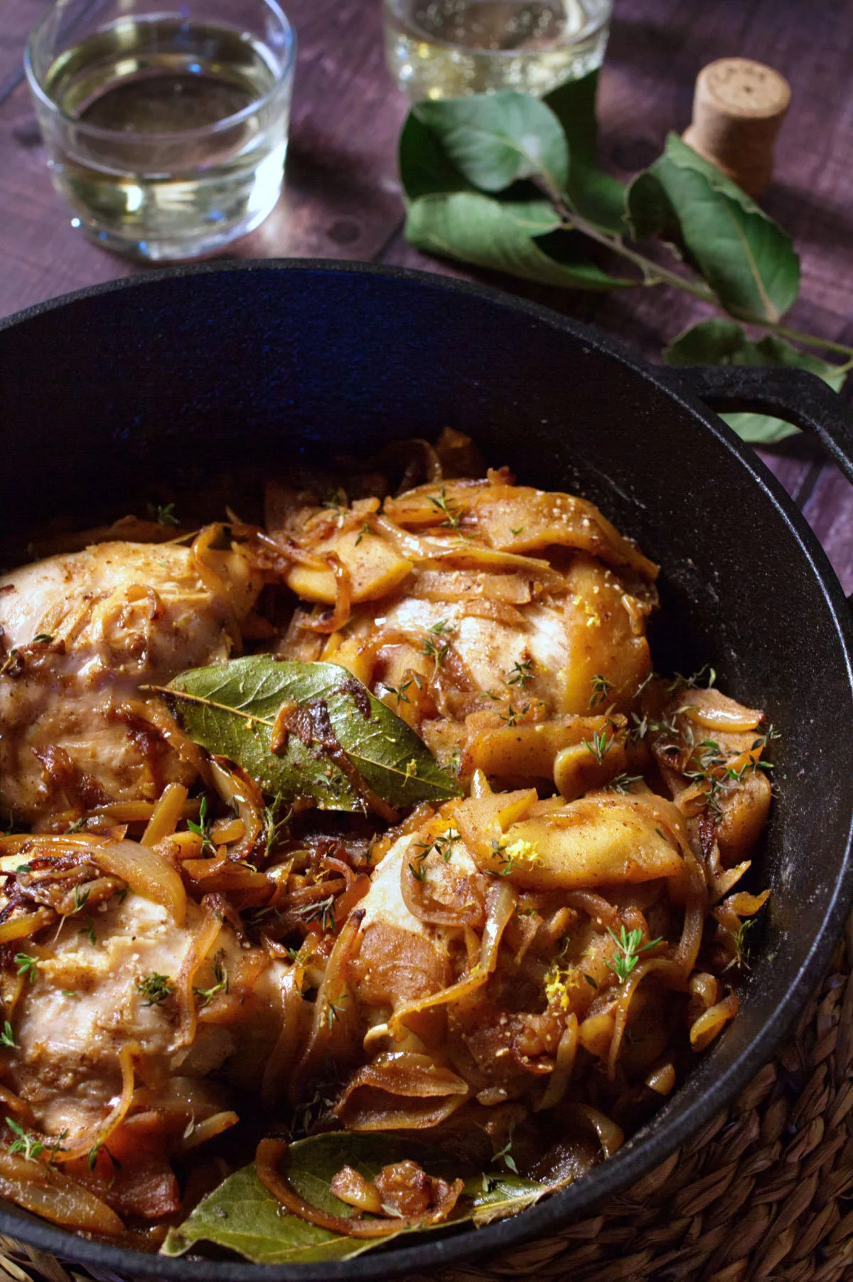 A large pot of one pot chicken thighs in cava and caramelized apples.