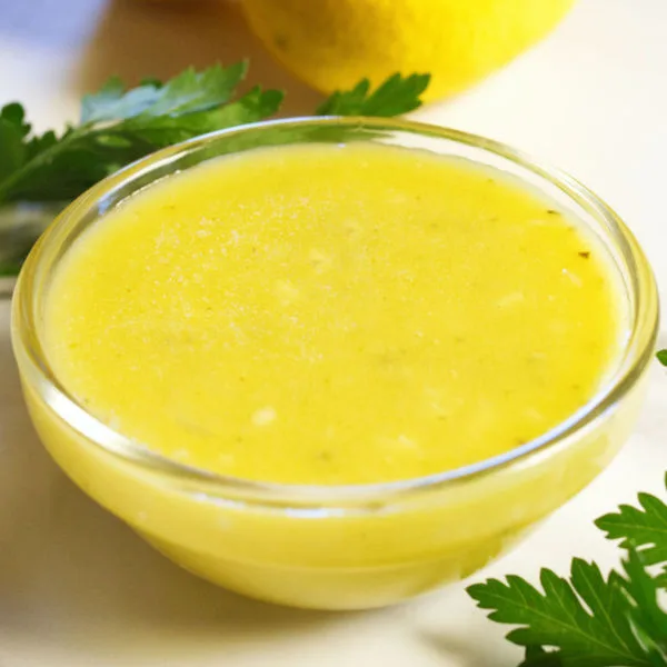 30-second Lemon Vinaigrette sits beside some fresh lemons