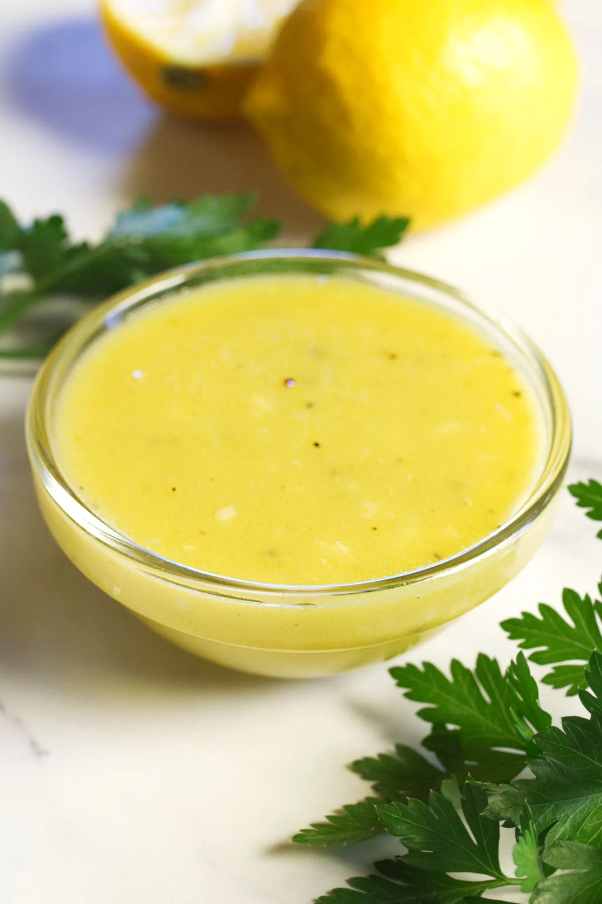 30-second Lemon Vinaigrette sits beside some fresh lemons