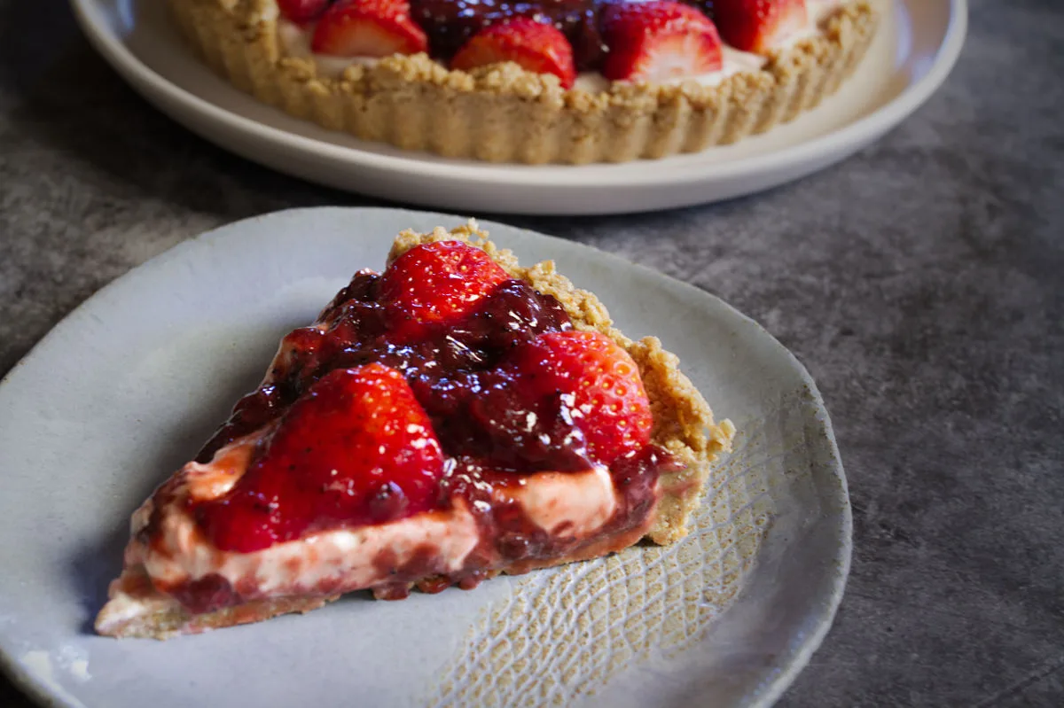 A slice of strawberry cheesecake.