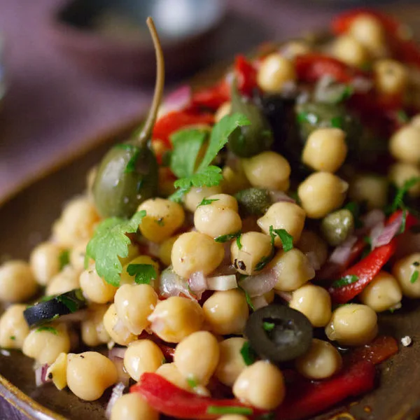 A dish of chickpea and caper salad