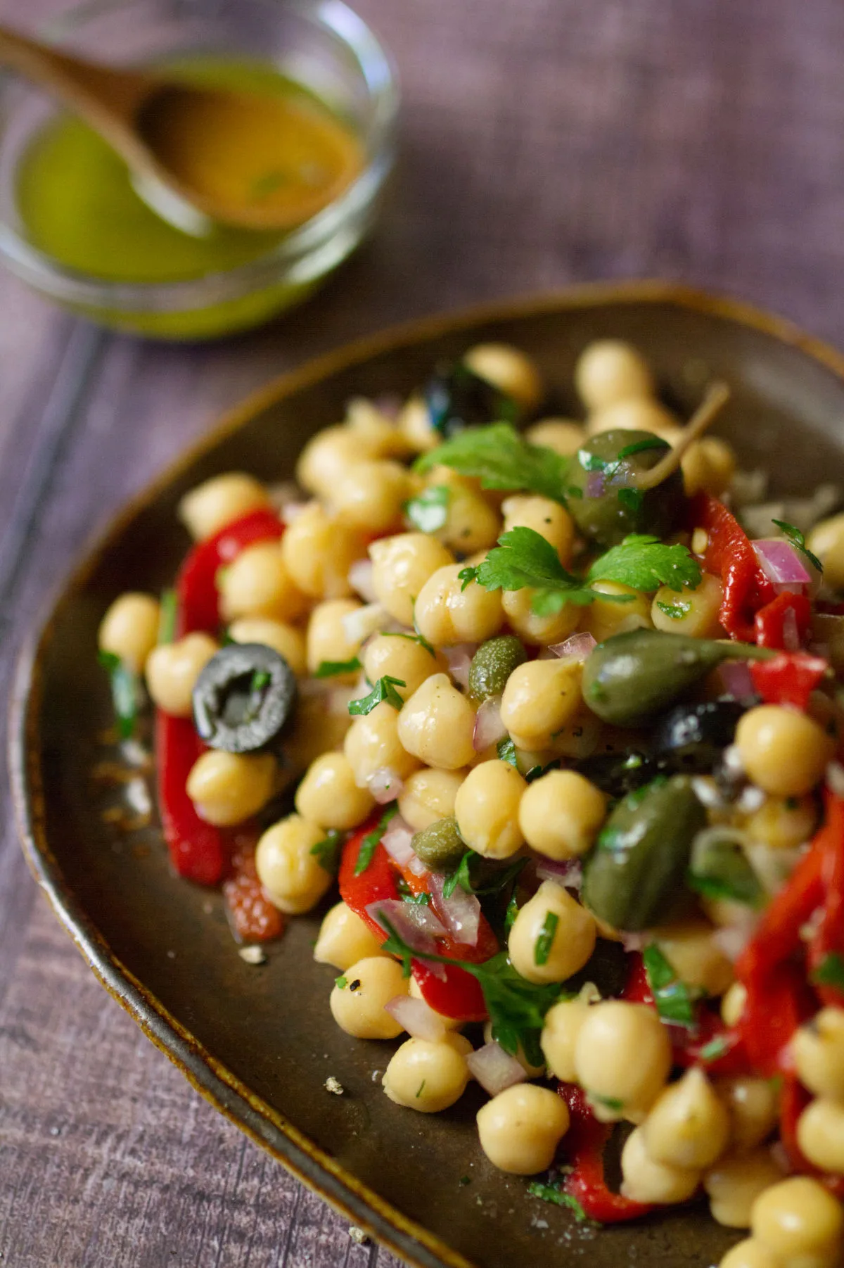 A dish of chickpea and caper salad