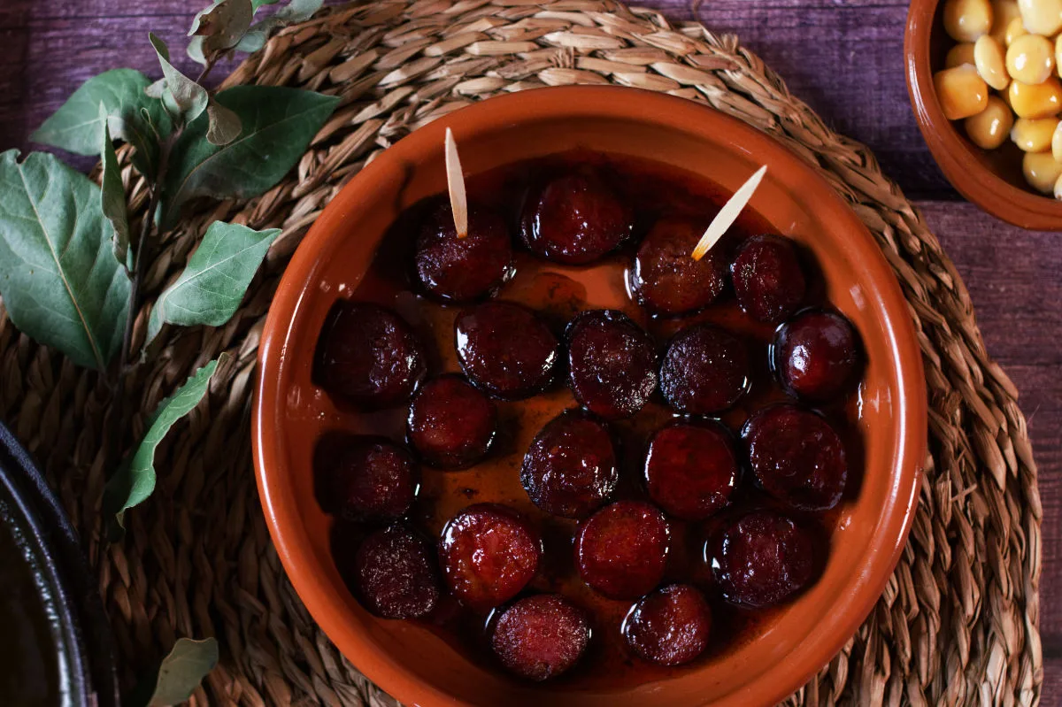 A small tapas serving of chorizo in red wine