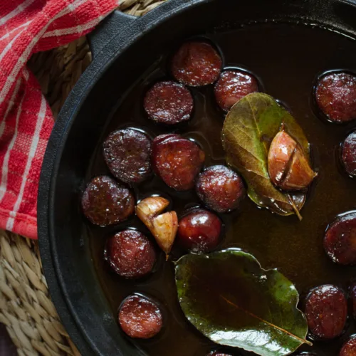 A pan of chorizo in red wine