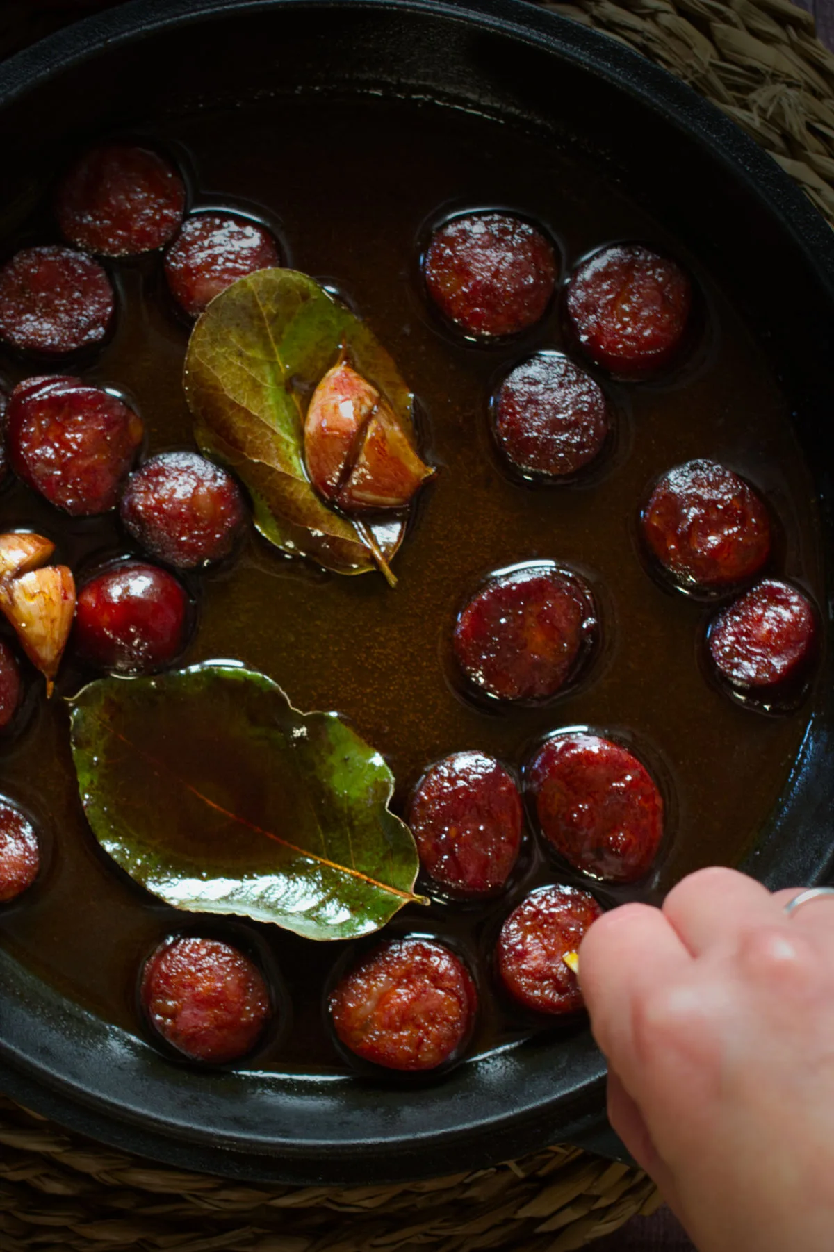 A pan of chorizo in red wine